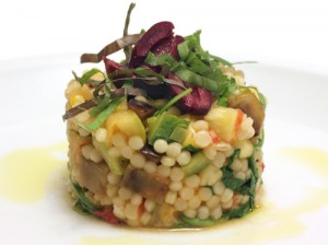Israeli CousCous Served with Asparagus, Cherry Tomatoes.